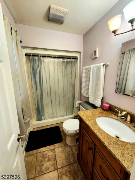 12 Old Coach Road Vernon, NJ 07462 - Photo 9 of 19 a bathroom with a granite countertop sink toilet and shower
