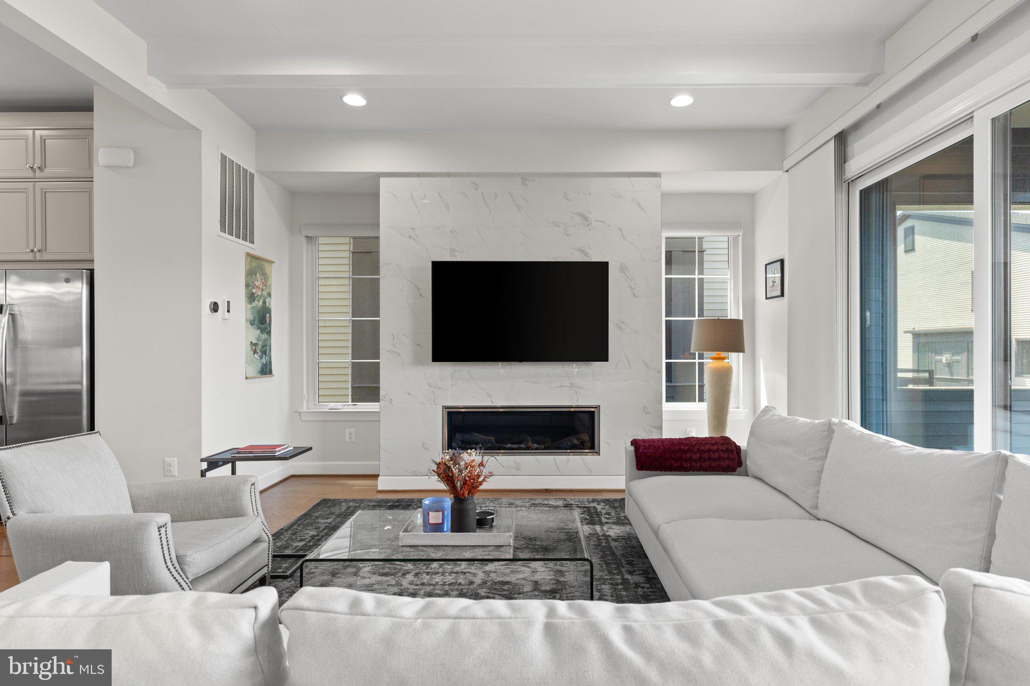 20375 Codman Drive Ashburn, VA 20147 - Photo 20 of 63 Built ins flanking modern fireplace