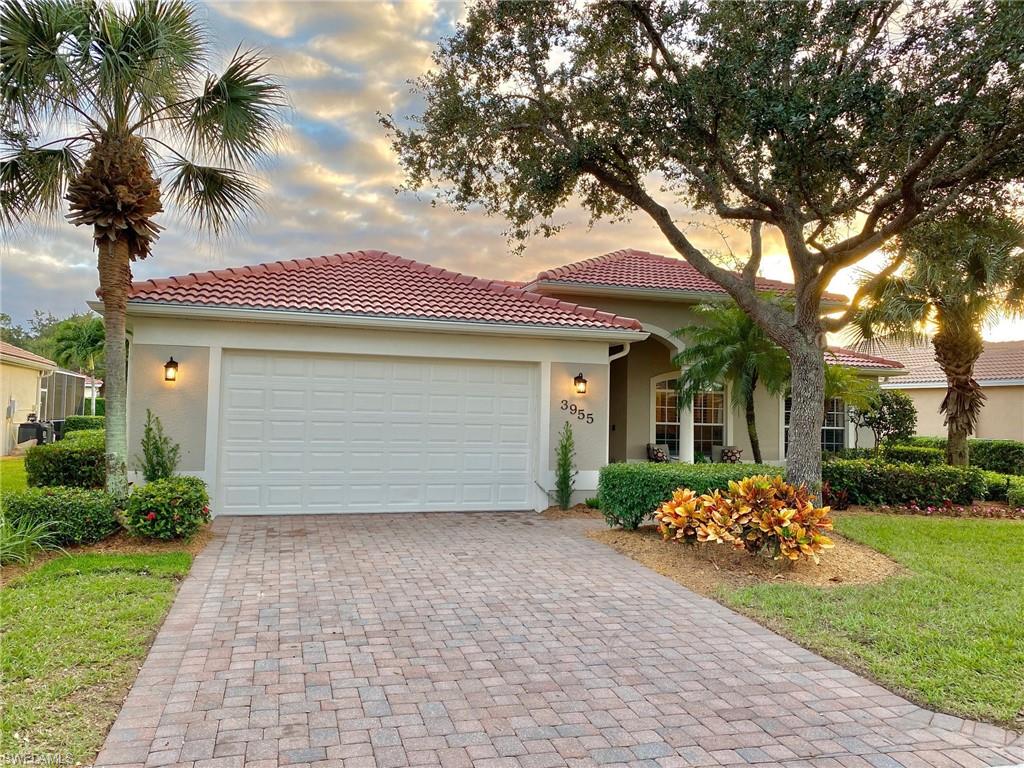 3955 Ruxton Road Naples, FL 34116 - Photo 3 of 23 front view of a house with a yard