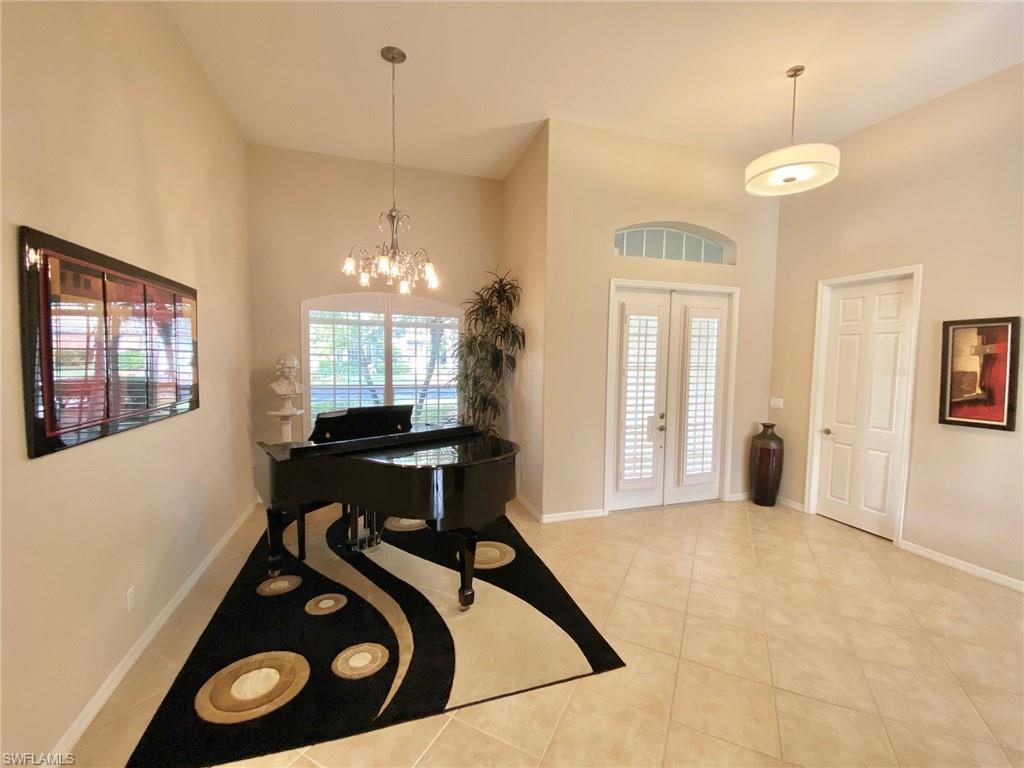 3955 Ruxton Road Naples, FL 34116 - Photo 7 of 23 a view of a livingroom with furniture and window