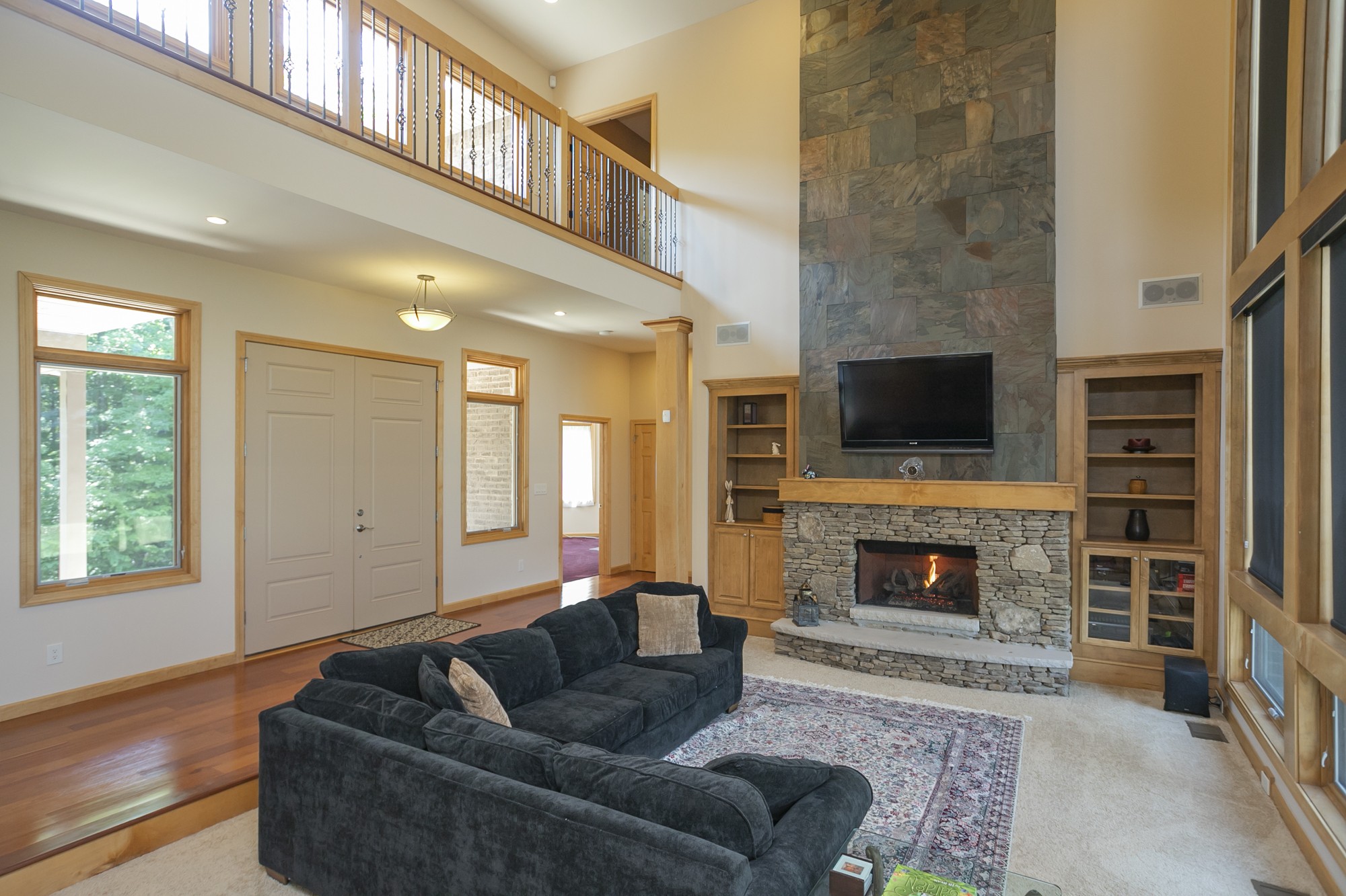 796 Thompson Road Pegram, TN 37143 - Photo 4 of 38 a living room with furniture a flat screen tv and a fireplace