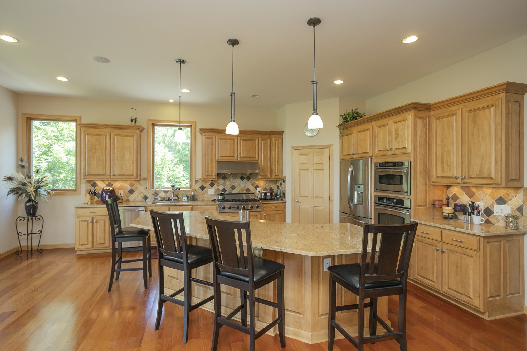 796 Thompson Road Pegram, TN 37143 - Photo 8 of 38 a view of a dining room and livingroom with furniture wooden floor a chandelier
