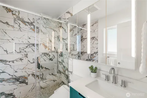 a bathroom with a sink and a mirror