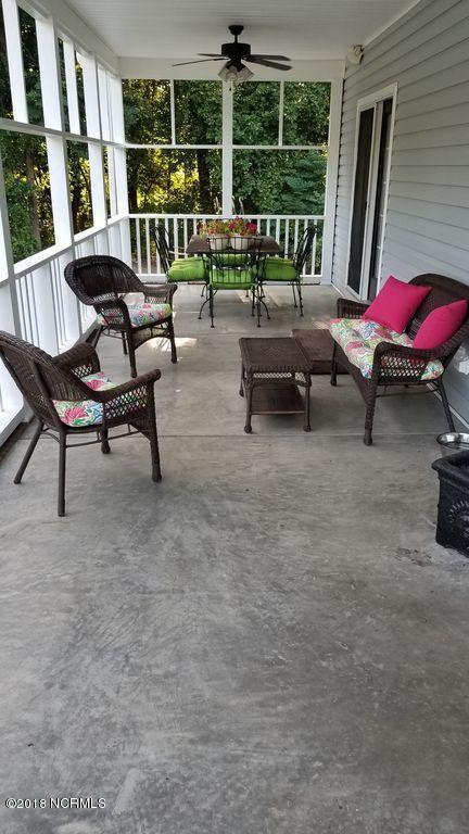 4561 Edgewater Road Elm City, NC 27822 - Photo 23 of 24 Screened in Back Porch