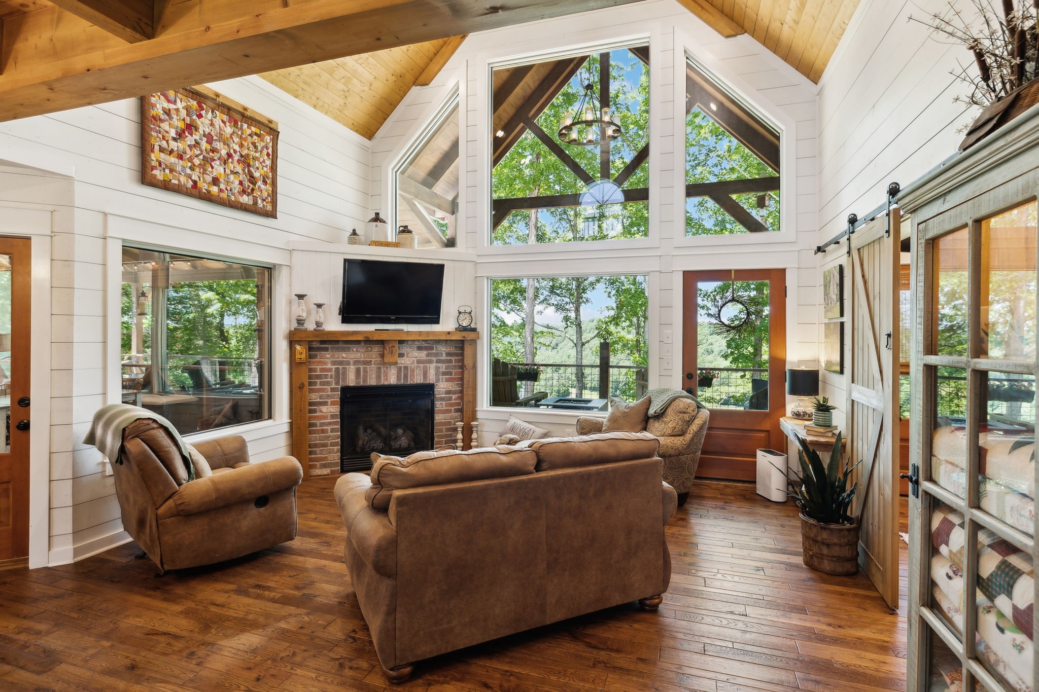 1606 Nosegay Road White Bluff, TN 37187 - Photo 18 of 88 a living room with furniture a fireplace and a floor to ceiling window