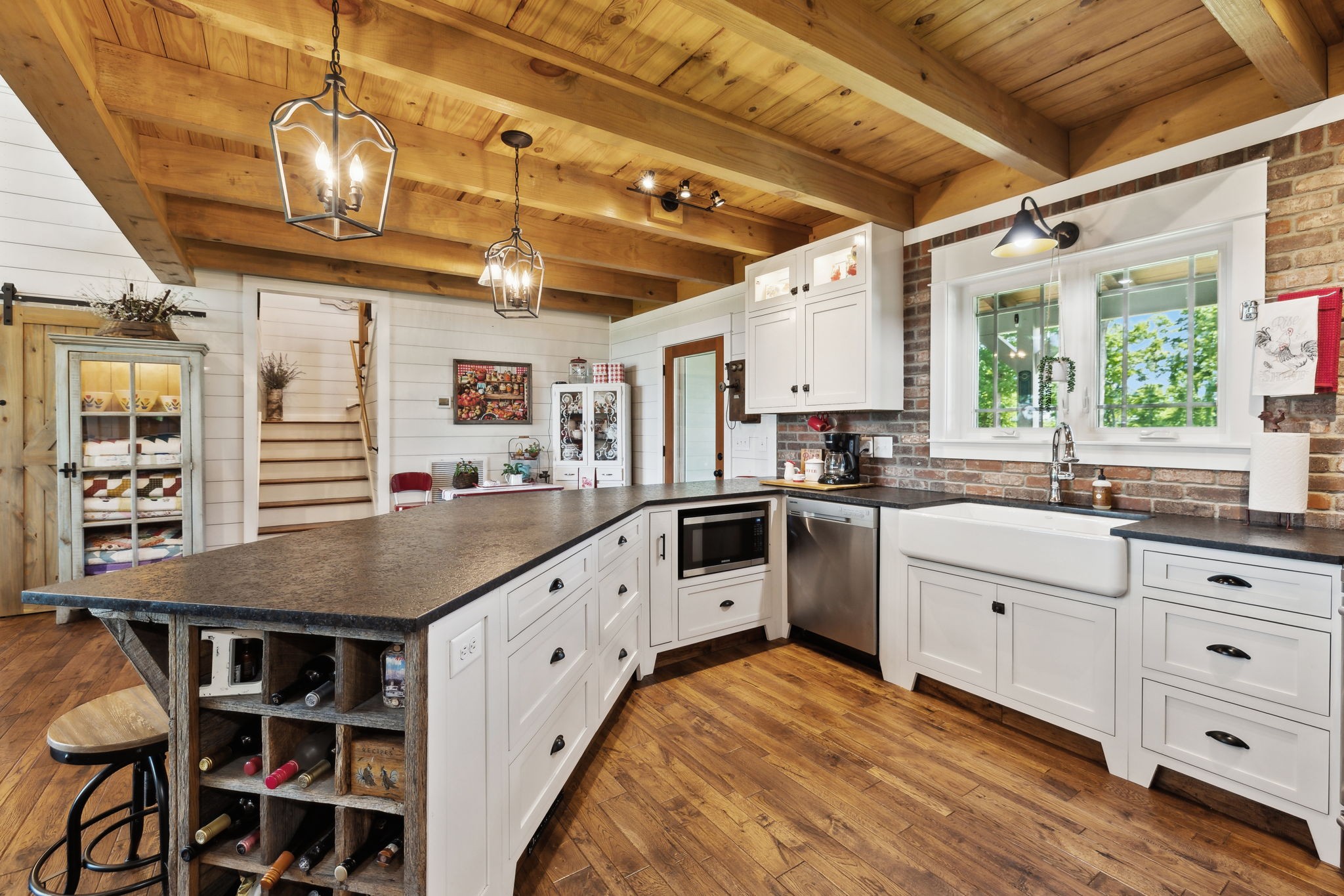 1606 Nosegay Road White Bluff, TN 37187 - Photo 22 of 88 a kitchen with cabinets appliances and a chandelier