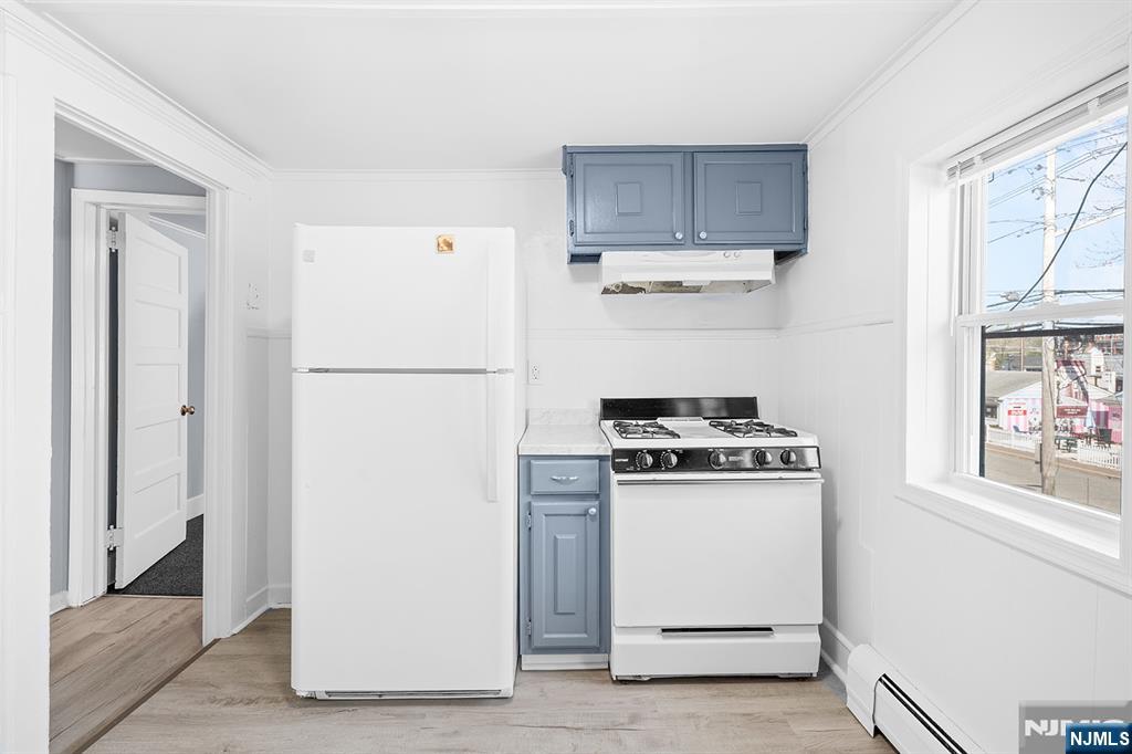 140 Park Avenue, Unit 2 Park Ridge, NJ 07656 - Photo 12 of 19 a white refrigerator freezer sitting inside of a kitchen