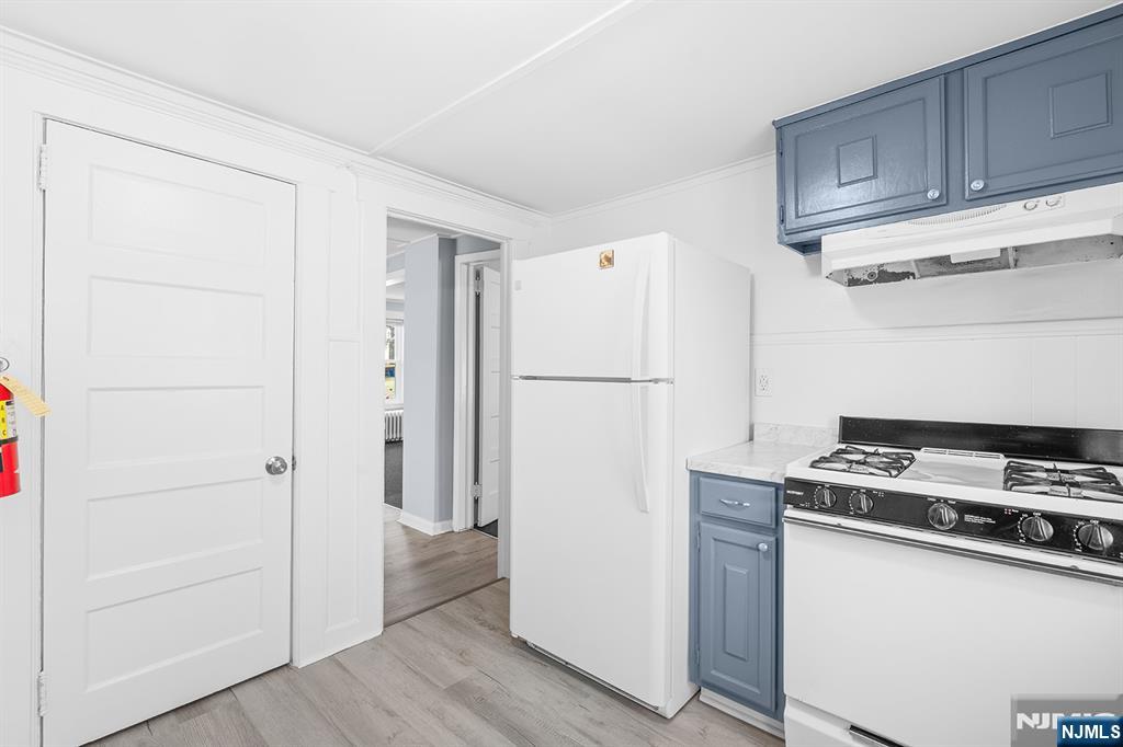 140 Park Avenue, Unit 2 Park Ridge, NJ 07656 - Photo 13 of 19 a kitchen with a refrigerator and a stove top oven