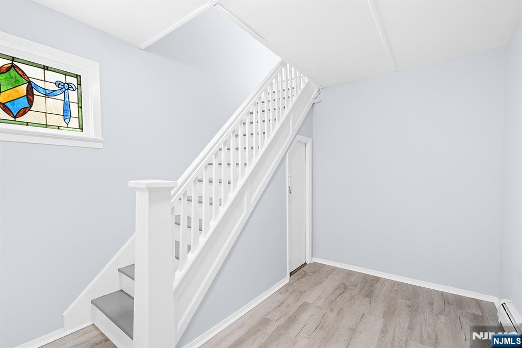 140 Park Avenue, Unit 2 Park Ridge, NJ 07656 - Photo 16 of 19 a view of staircase with wooden floor and white walls
