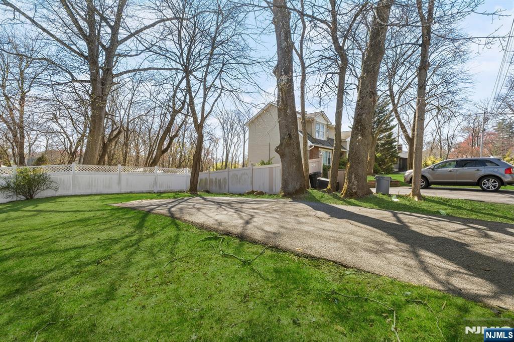 140 Park Avenue, Unit 2 Park Ridge, NJ 07656 - Photo 19 of 19 a view of a backyard with a white house