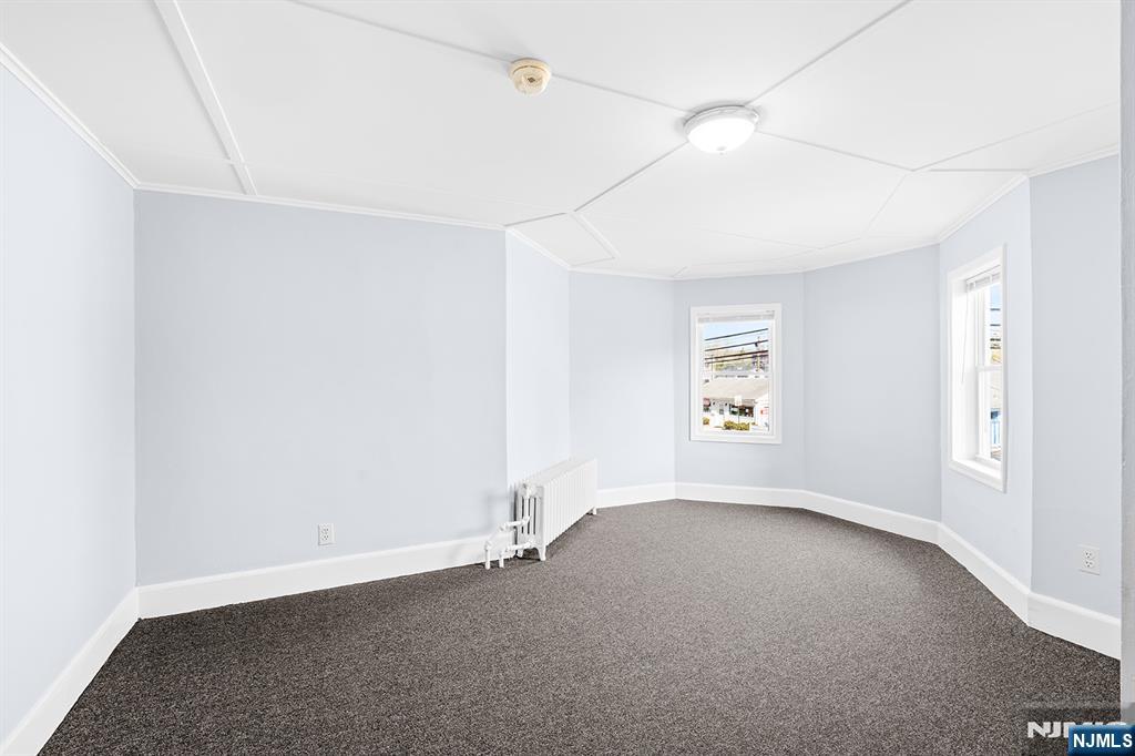 140 Park Avenue, Unit 2 Park Ridge, NJ 07656 - Photo 3 of 19 an empty room with a empty space and windows