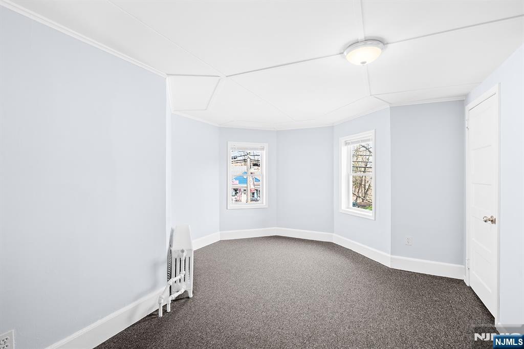 140 Park Avenue, Unit 2 Park Ridge, NJ 07656 - Photo 4 of 19 an empty room with a window