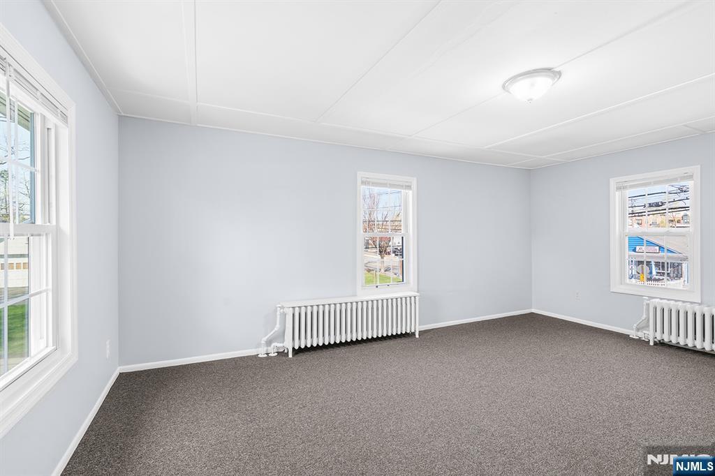 140 Park Avenue, Unit 2 Park Ridge, NJ 07656 - Photo 7 of 19 an empty room with a window