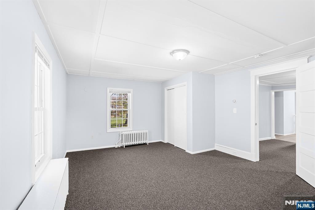 140 Park Avenue, Unit 2 Park Ridge, NJ 07656 - Photo 8 of 19 an empty room with windows