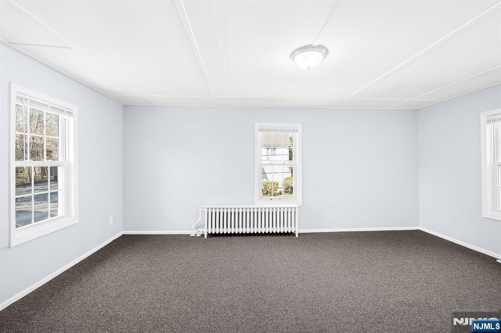 140 Park Avenue, Unit 2 Park Ridge, NJ 07656 - Photo 9 of 19 an empty room with a window