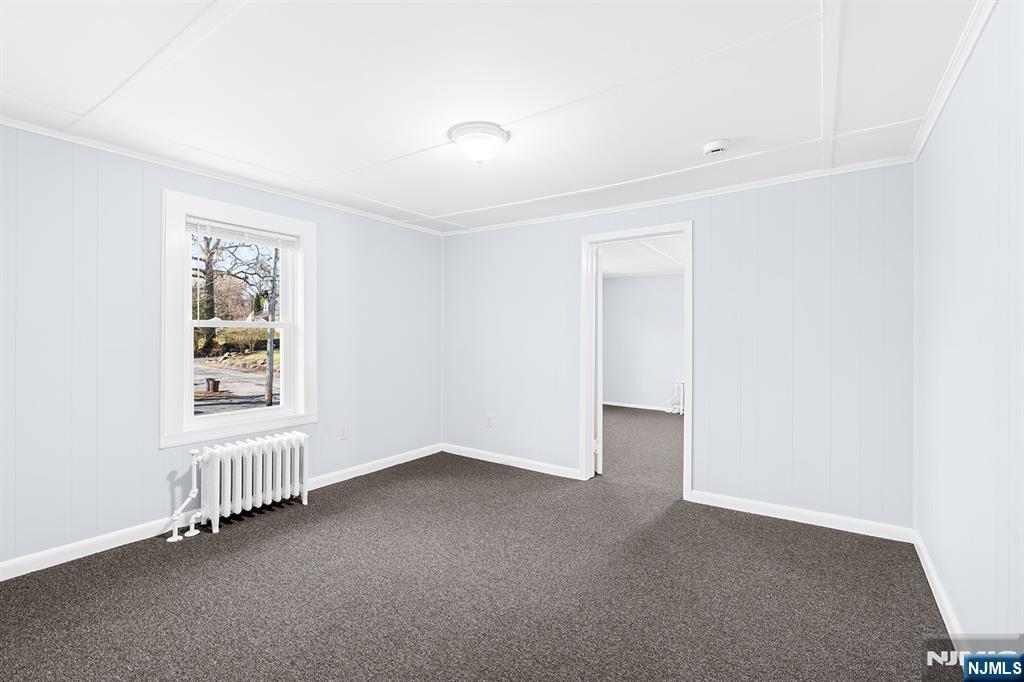 140 Park Avenue, Unit 2 Park Ridge, NJ 07656 - Photo 10 of 19 a view of an empty room with a window