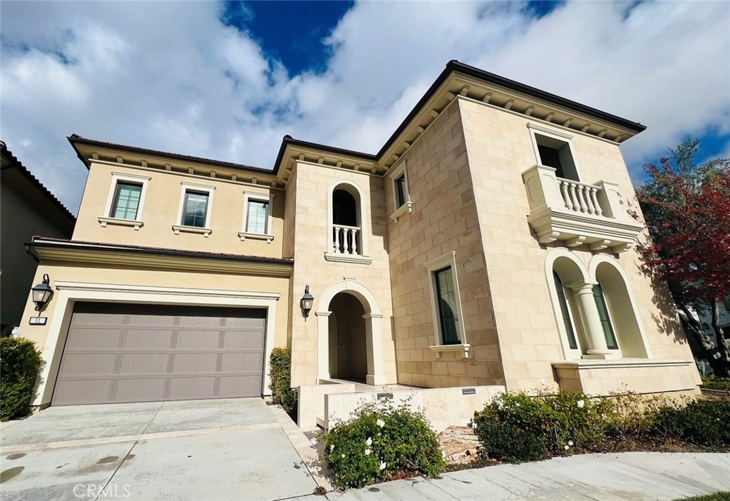 a front view of a house with a garage
