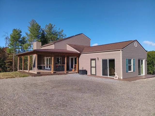 a view of a bench in wooden floor