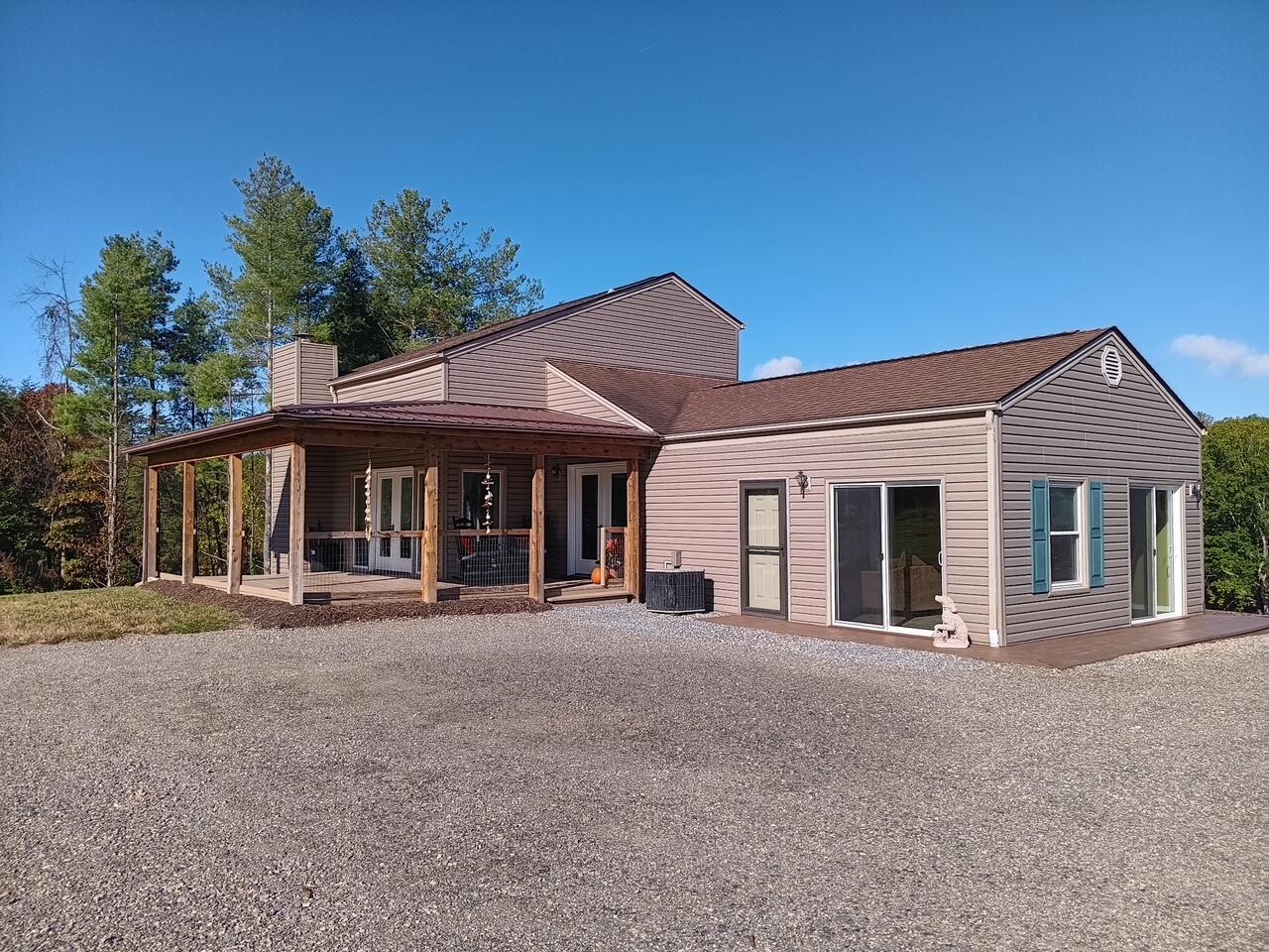 6000 Ferrum Mountain Road Callaway, VA 24067 - Photo 3 of 58 a front view of a house with a yard