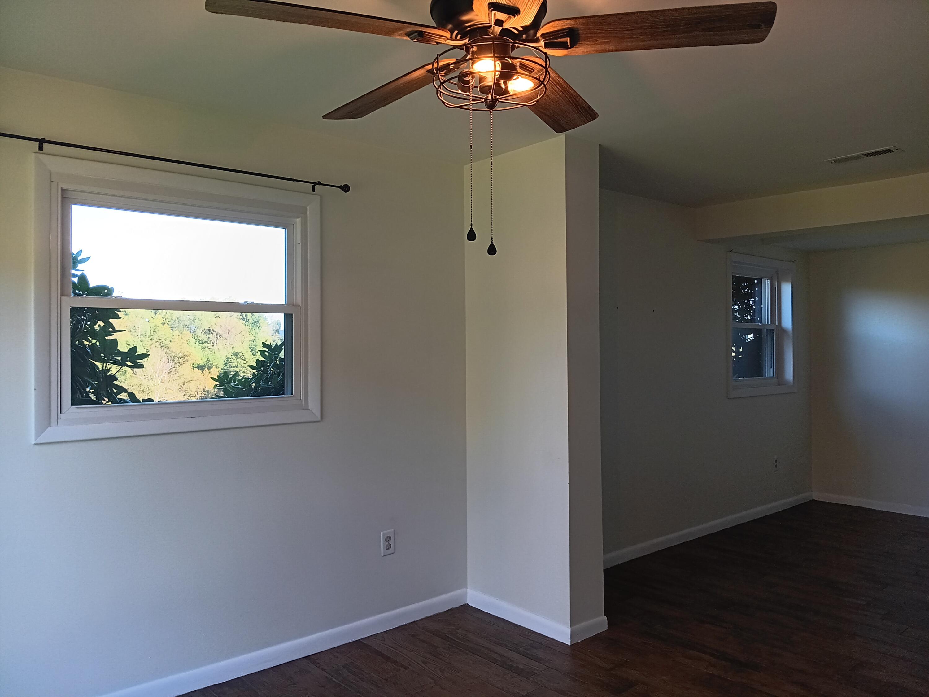 6000 Ferrum Mountain Road Callaway, VA 24067 - Photo 45 of 58 a view of a room with wooden floor closet and a chandelier fan
