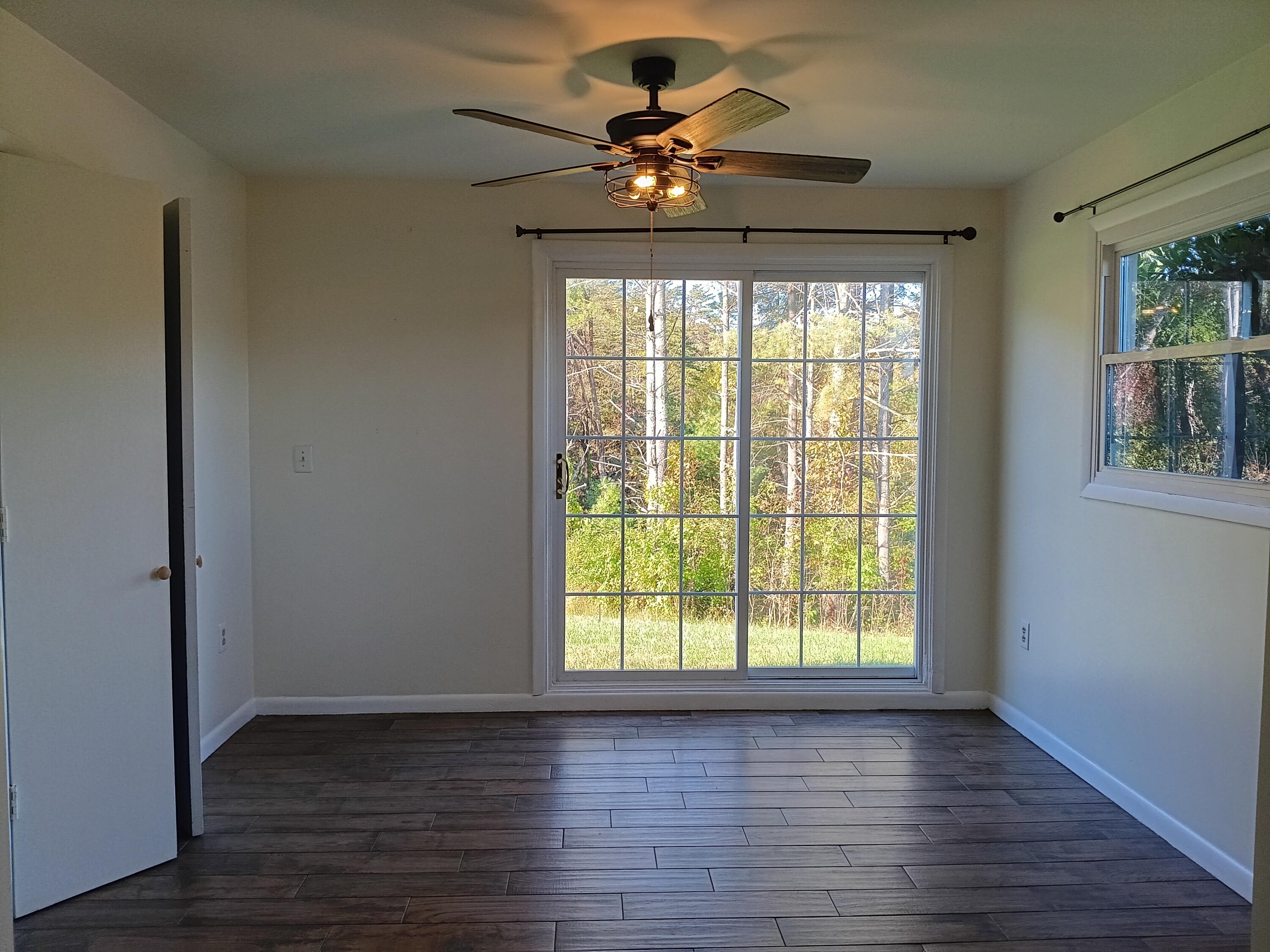 6000 Ferrum Mountain Road Callaway, VA 24067 - Photo 46 of 58 a view of an empty room with wooden floor and a window