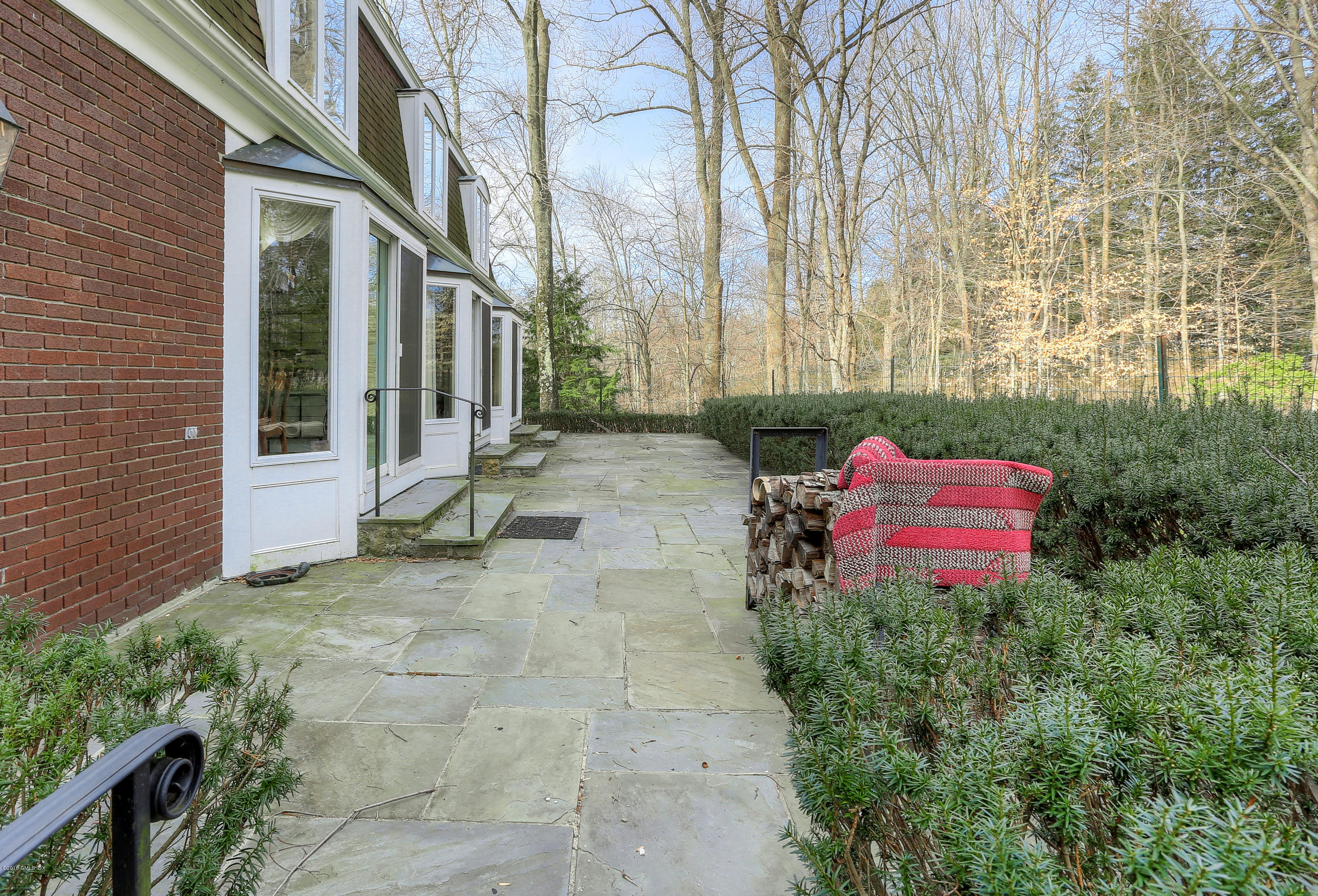 73 Taconic Road Greenwich, CT 06831 - Photo 19 of 24 a backyard of a house with seating space