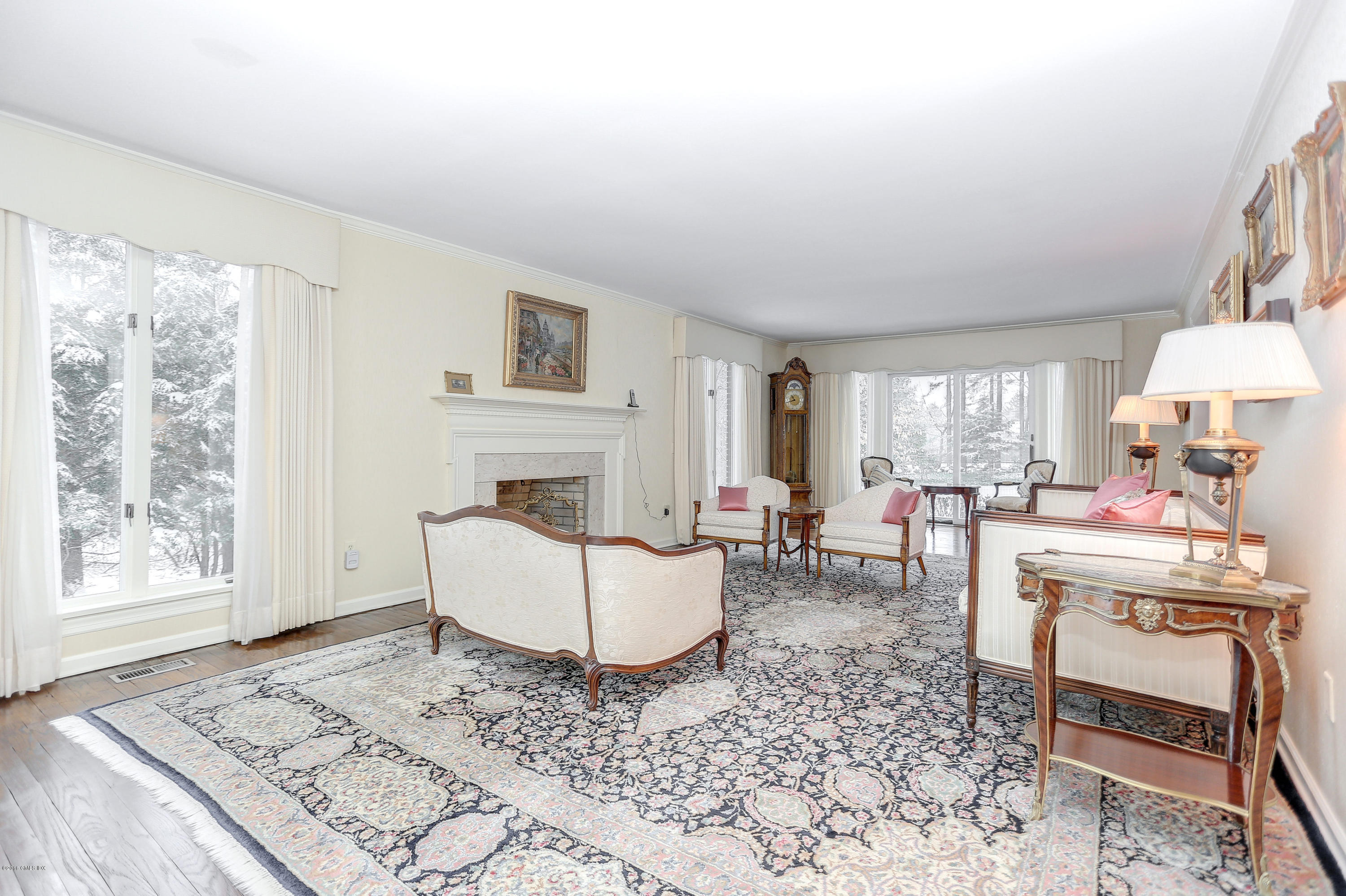 73 Taconic Road Greenwich, CT 06831 - Photo 5 of 24 a living room with furniture and a fireplace