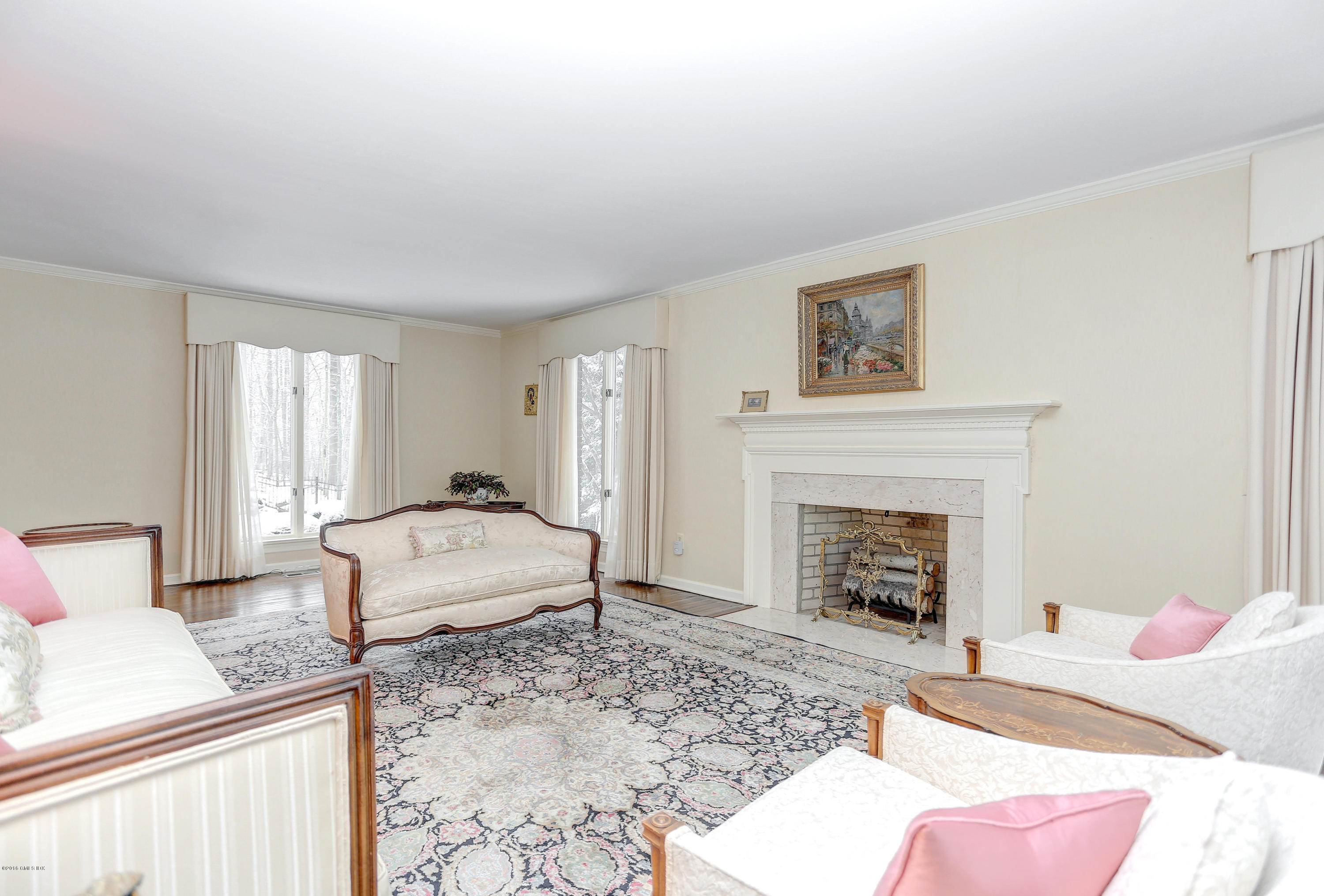 73 Taconic Road Greenwich, CT 06831 - Photo 7 of 24 a living room with furniture and a fireplace