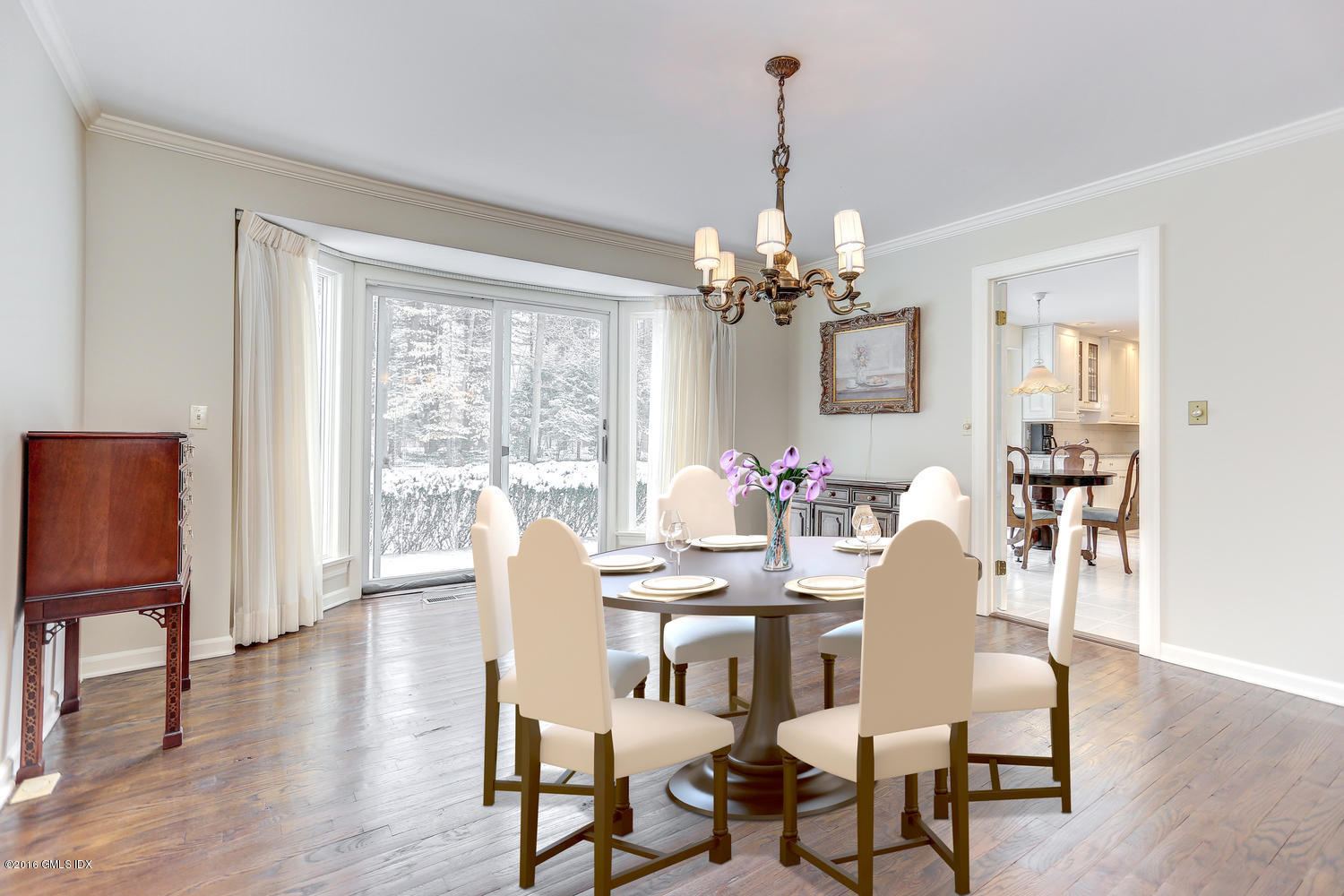 73 Taconic Road Greenwich, CT 06831 - Photo 8 of 24 a dining room with furniture a chandelier and wooden floor