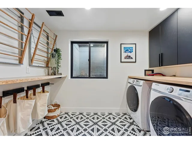 a bathroom with a sink a toilet a mirror and shower