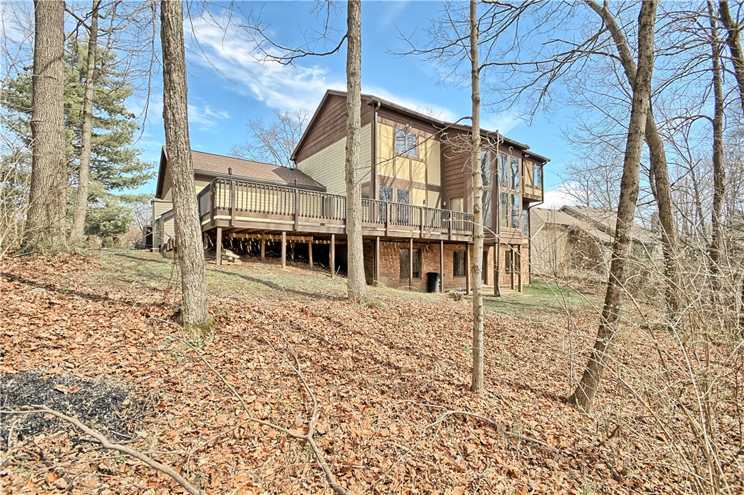 8711 Nicole Lane Springboro, OH 45066 - Photo 81 of 87 This spacious home features a large outdoor deck and a wooded setting.