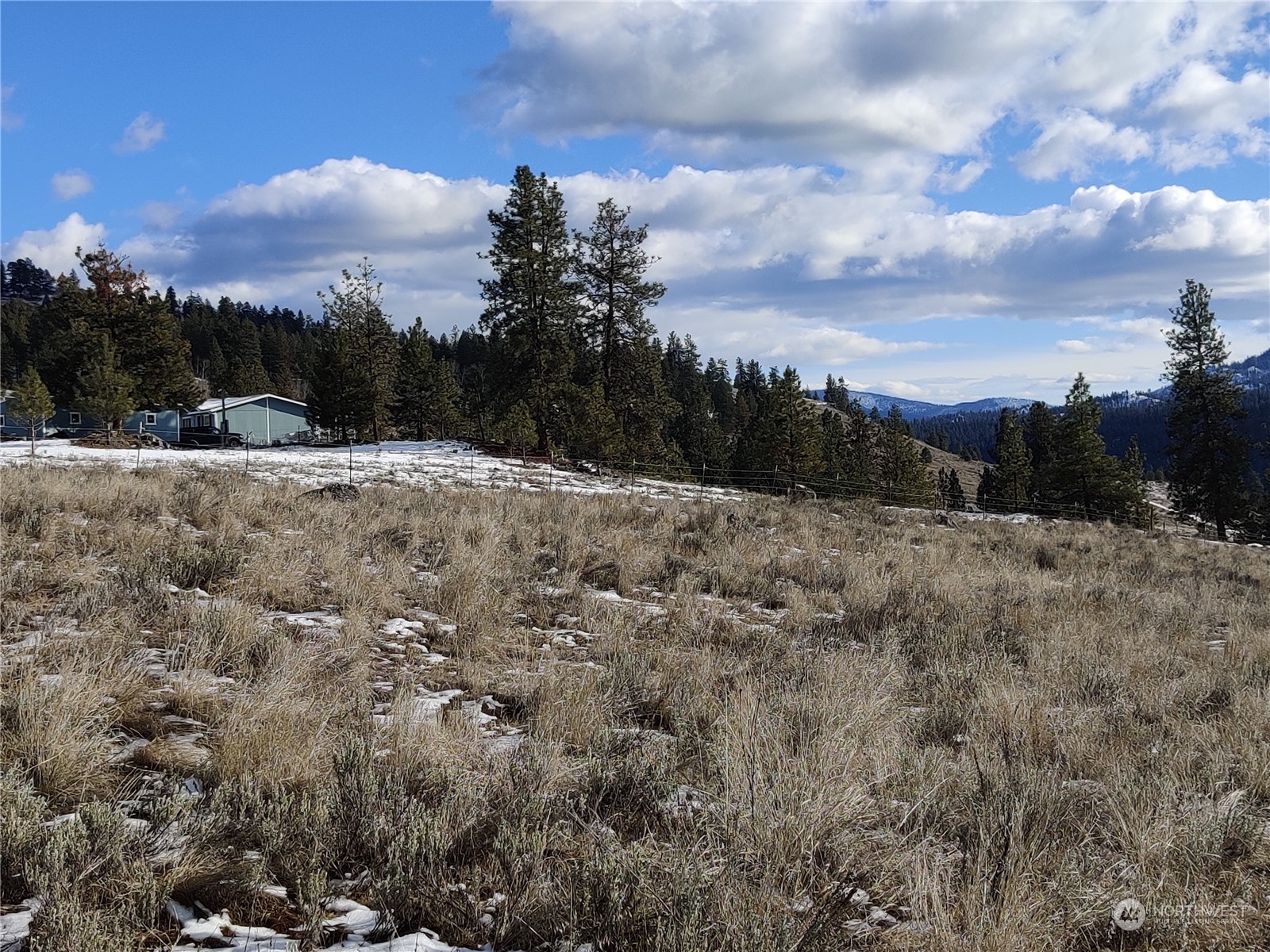 73 Main Road Tonasket, WA 98855 - Photo 6 of 16 a view of a covered with snow in the background