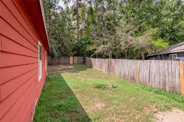 a backyard of a house with a garden and deck