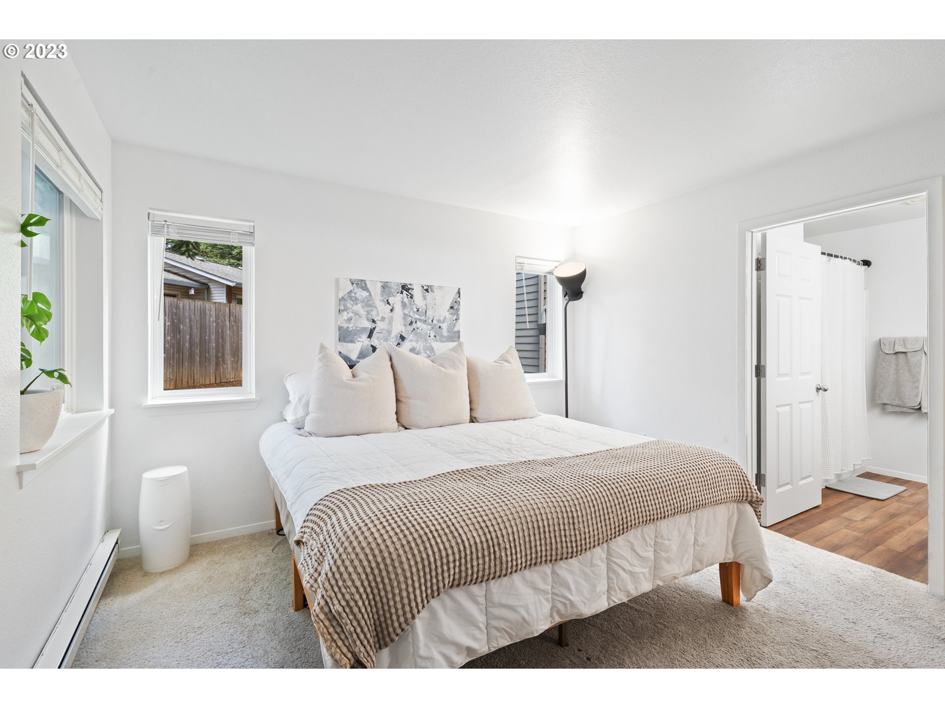 5225 Jean Road, Unit 309 Lake Oswego, OR 97035 - Photo 14 of 26 a bedroom with a bed and a large mirror