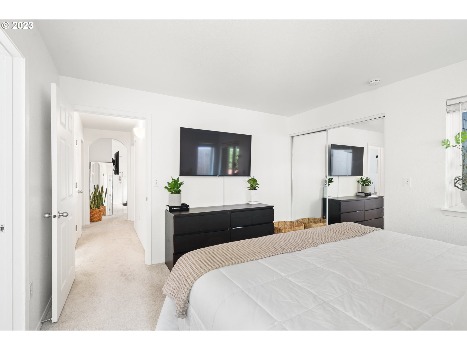 5225 Jean Road, Unit 309 Lake Oswego, OR 97035 - Photo 15 of 26 a bedroom with a bed and a large mirror