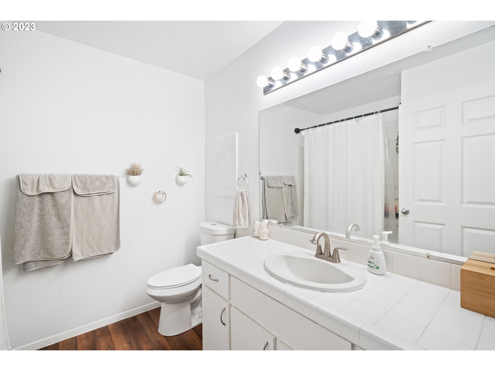5225 Jean Road, Unit 309 Lake Oswego, OR 97035 - Photo 17 of 26 a bathroom with a sink a toilet and mirror
