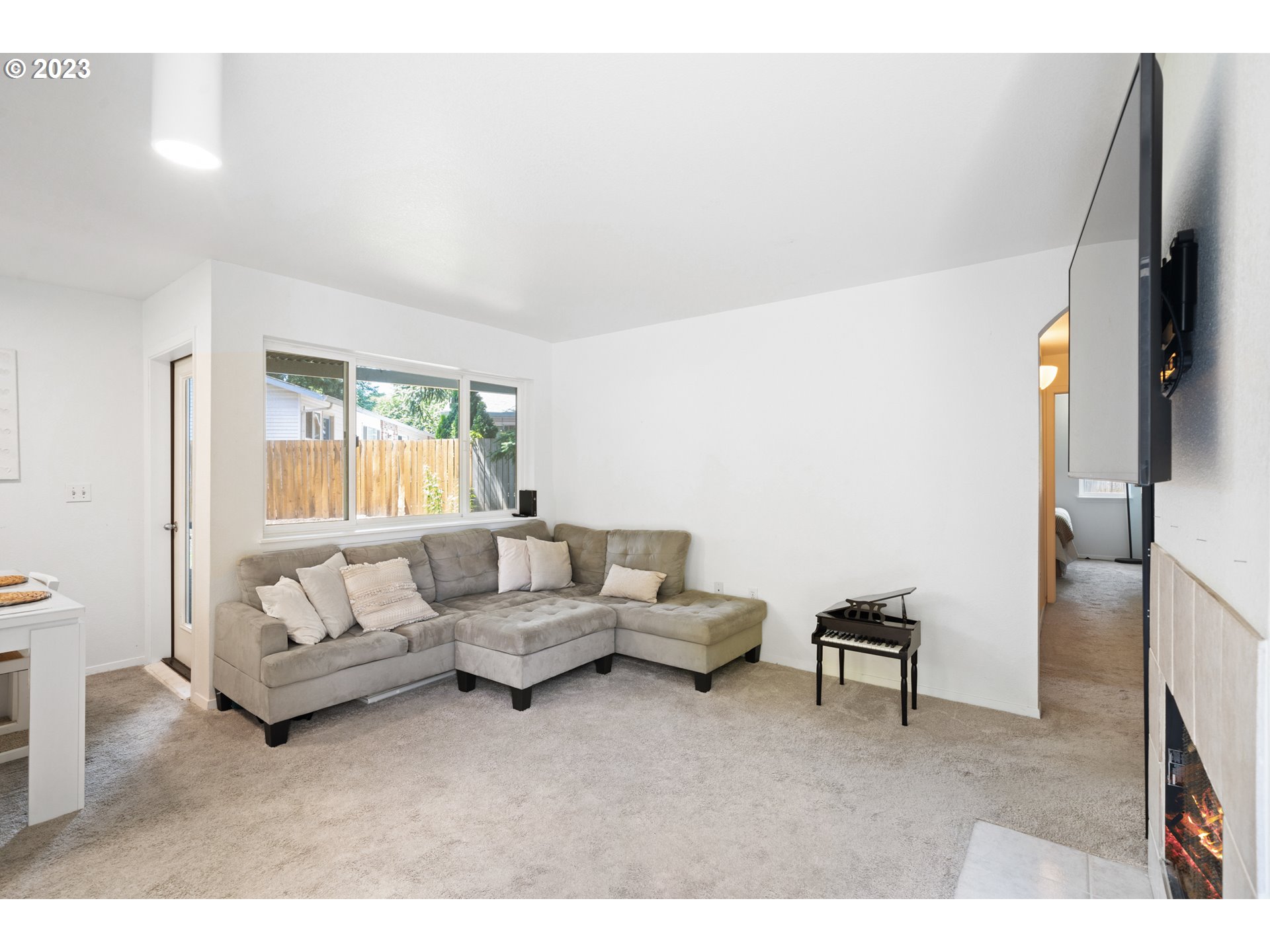 5225 Jean Road, Unit 309 Lake Oswego, OR 97035 - Photo 2 of 26 a living room with furniture and a flat screen tv