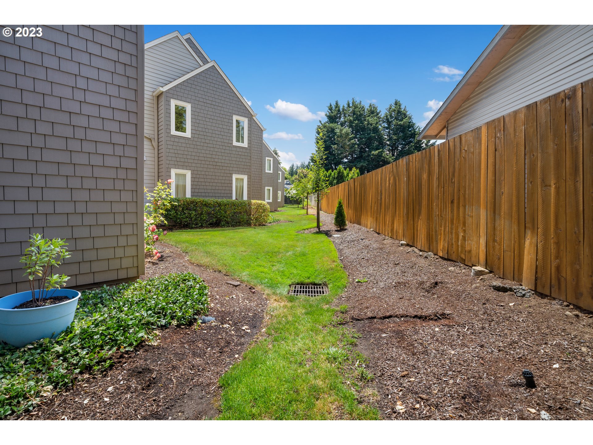 5225 Jean Road, Unit 309 Lake Oswego, OR 97035 - Photo 23 of 26 a view of a house with backyard and garden