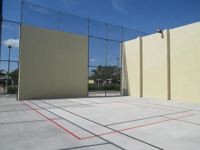 a view of a swimming pool with an outdoor seating
