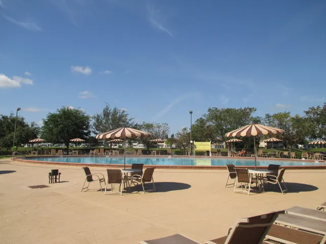 a view of swimming pool from a balcony