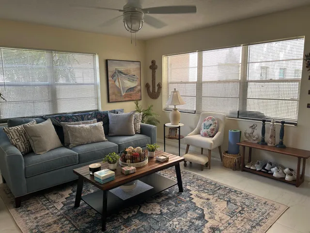 a living room with furniture and a rug