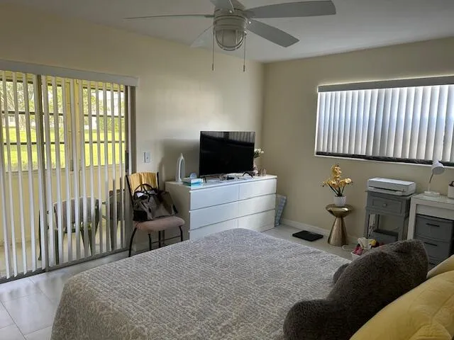 a bedroom with a bed and a tv