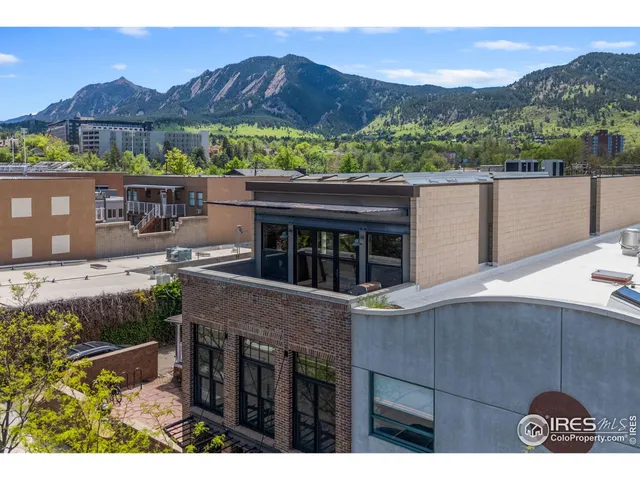 a view of a house with a yard and balcony