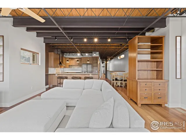a view of living room with furniture and a flat screen tv