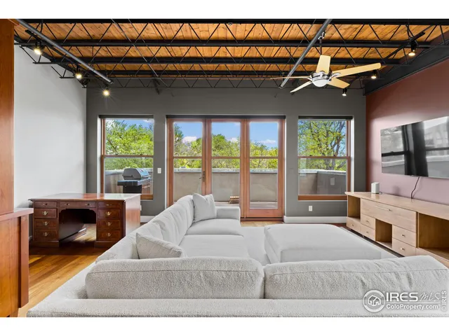 a bedroom with a bed and a mirror