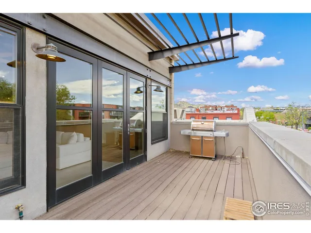 a view of balcony with wooden floor