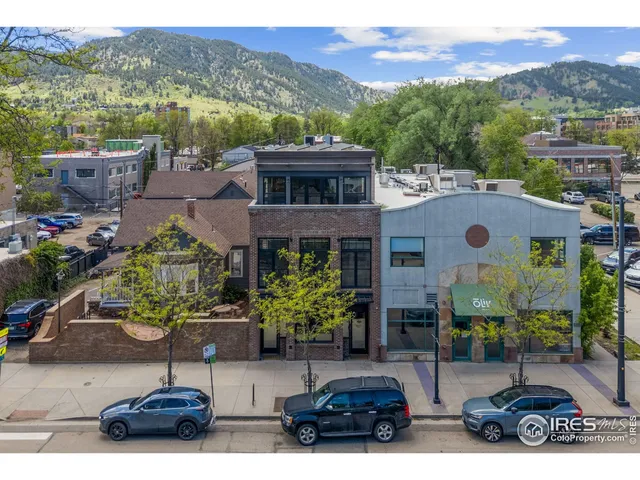 a view of a city with mountains in the background