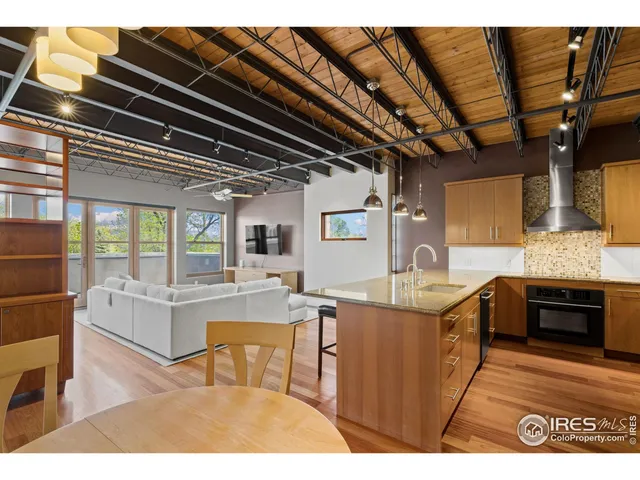 a kitchen with a table and chairs in it