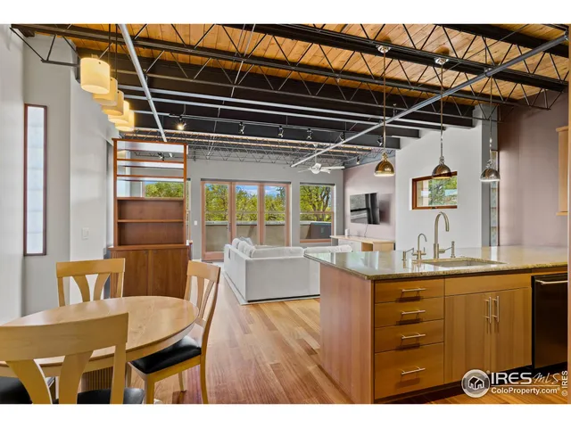 a kitchen with granite countertop a sink and a stove