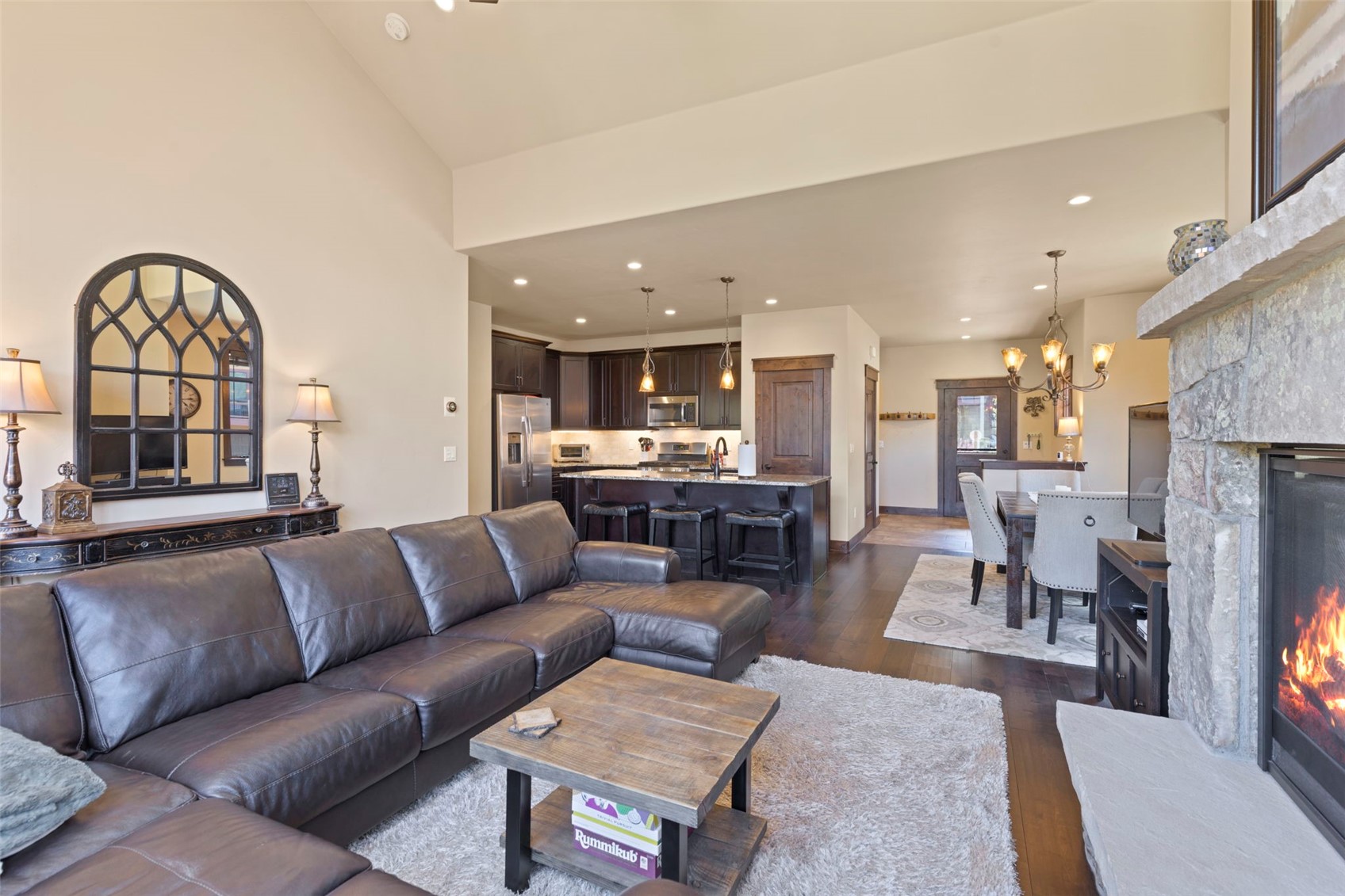 799 Independence Road, Unit 799 Keystone, CO 80435 - Photo 8 of 44 Living area featuring a tile fireplace, dark wood finished floors, recessed lighting, and a chandelier